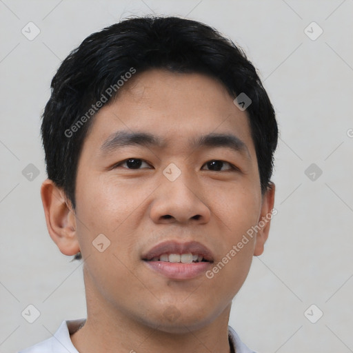 Joyful asian young-adult male with short  black hair and brown eyes