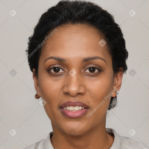 Joyful black young-adult female with short  black hair and brown eyes