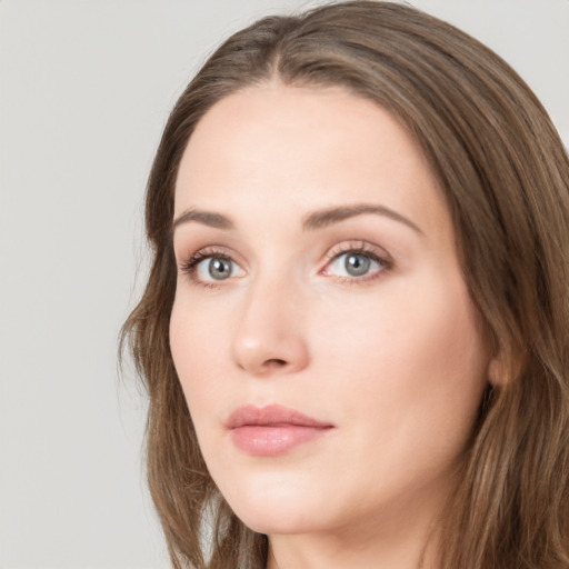 Neutral white young-adult female with long  brown hair and green eyes