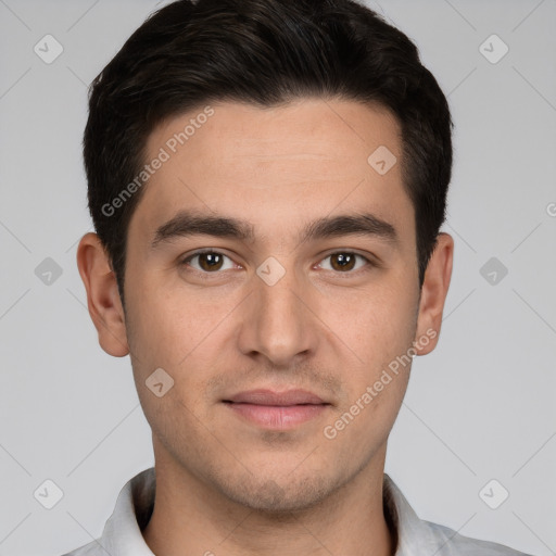 Joyful white young-adult male with short  black hair and brown eyes