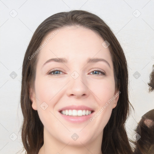 Joyful white young-adult female with long  brown hair and grey eyes