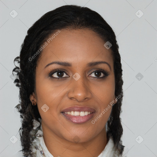 Joyful black young-adult female with long  brown hair and brown eyes