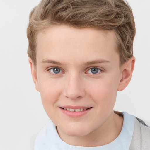 Joyful white child male with short  brown hair and grey eyes