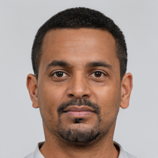 Neutral black young-adult male with short  black hair and brown eyes