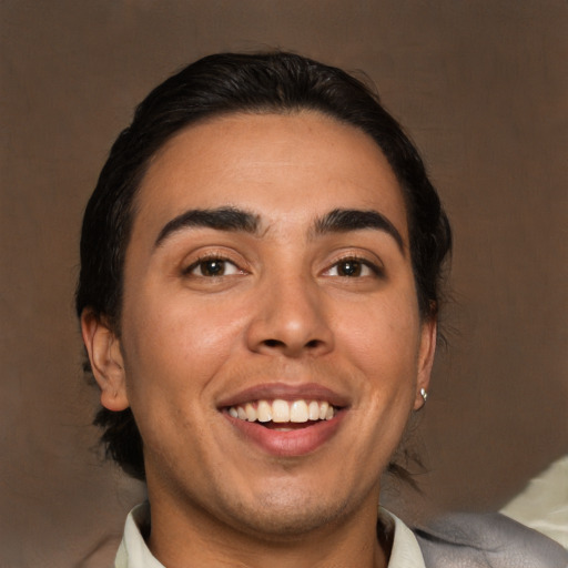 Joyful white young-adult male with medium  brown hair and brown eyes