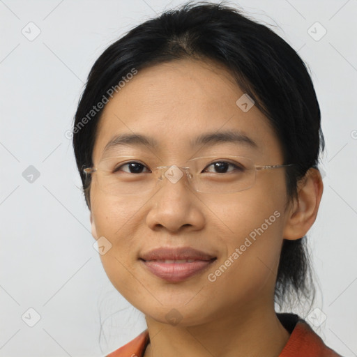 Joyful asian young-adult female with short  brown hair and brown eyes