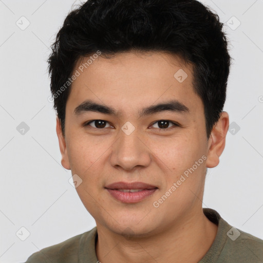 Joyful asian young-adult male with short  black hair and brown eyes