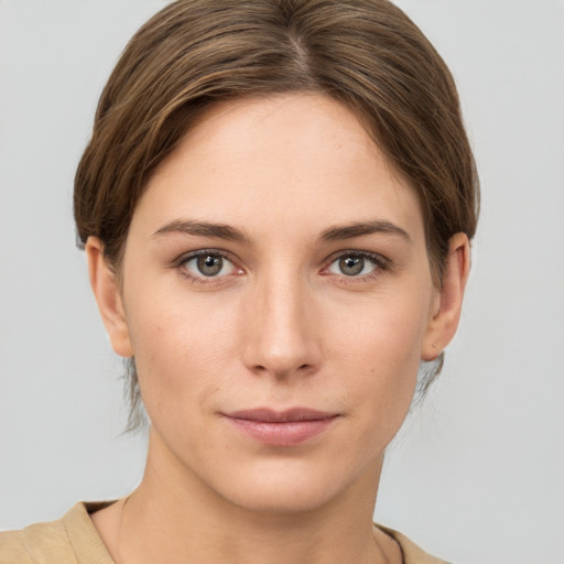 Neutral white young-adult female with short  brown hair and grey eyes