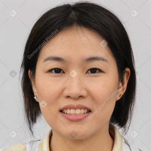 Joyful asian young-adult female with medium  brown hair and brown eyes