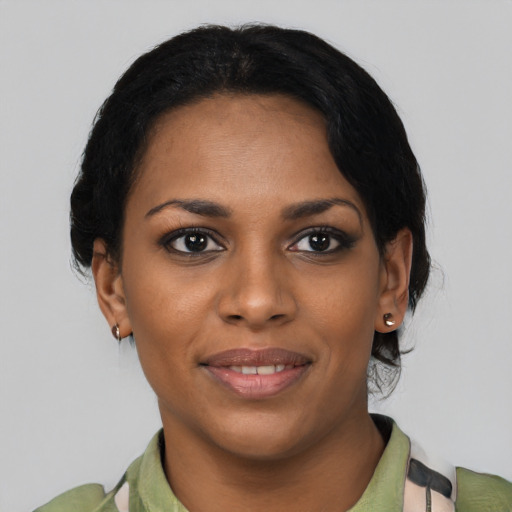 Joyful latino young-adult female with medium  black hair and brown eyes