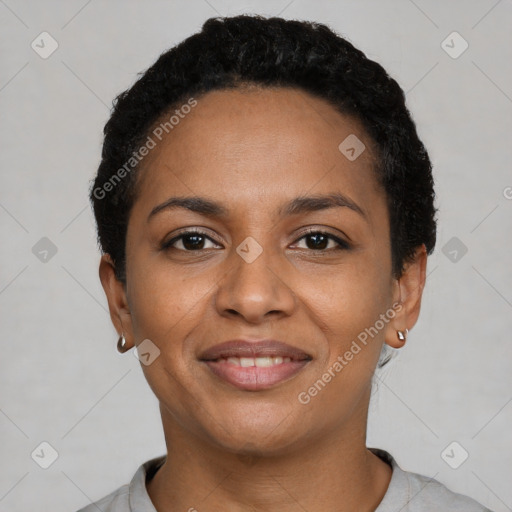 Joyful black young-adult female with short  black hair and brown eyes