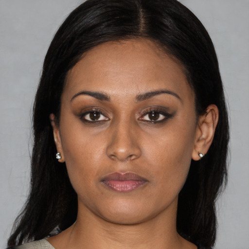 Neutral latino young-adult female with long  black hair and brown eyes