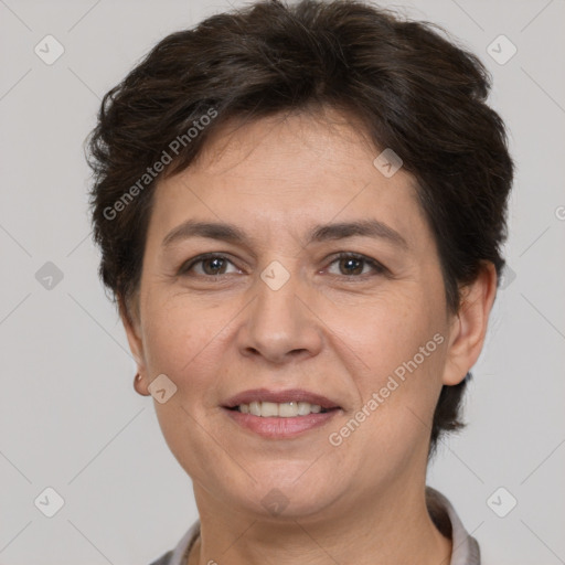 Joyful white adult female with short  brown hair and brown eyes