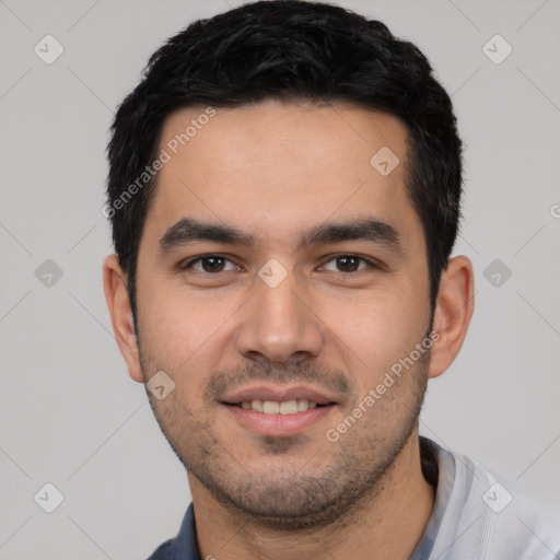 Joyful white young-adult male with short  black hair and brown eyes