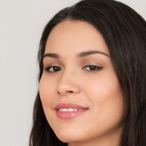 Joyful white young-adult female with long  black hair and brown eyes