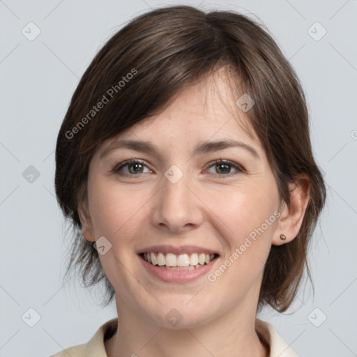 Joyful white young-adult female with medium  brown hair and grey eyes