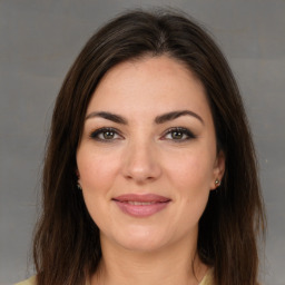 Joyful white young-adult female with medium  brown hair and brown eyes