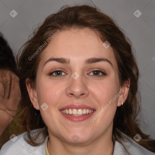 Joyful white adult female with medium  brown hair and brown eyes