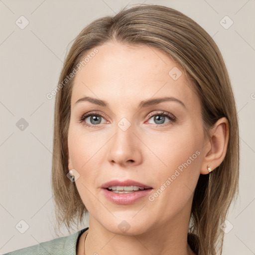 Joyful white young-adult female with medium  brown hair and grey eyes