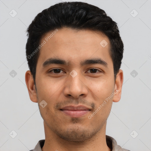 Joyful latino young-adult male with short  black hair and brown eyes