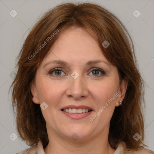 Joyful white adult female with medium  brown hair and grey eyes