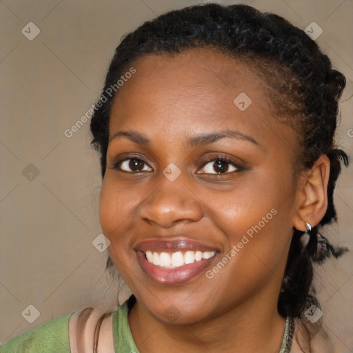 Joyful black young-adult female with medium  brown hair and brown eyes