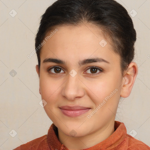 Joyful white young-adult female with short  brown hair and brown eyes