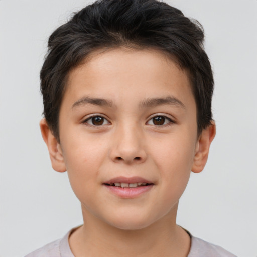 Joyful white child male with short  brown hair and brown eyes