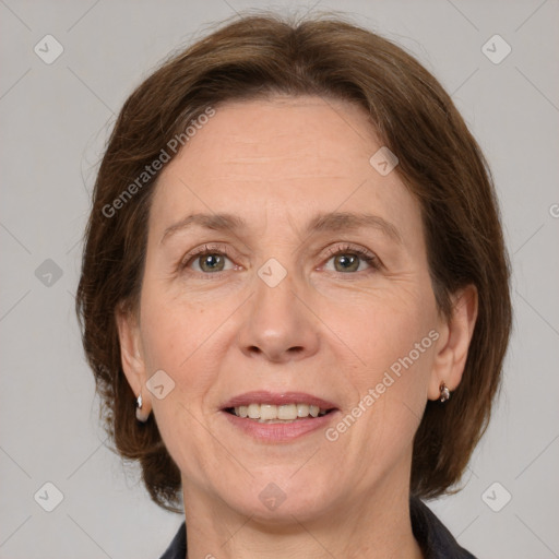 Joyful white adult female with medium  brown hair and grey eyes