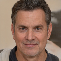 Joyful white middle-aged male with short  brown hair and brown eyes