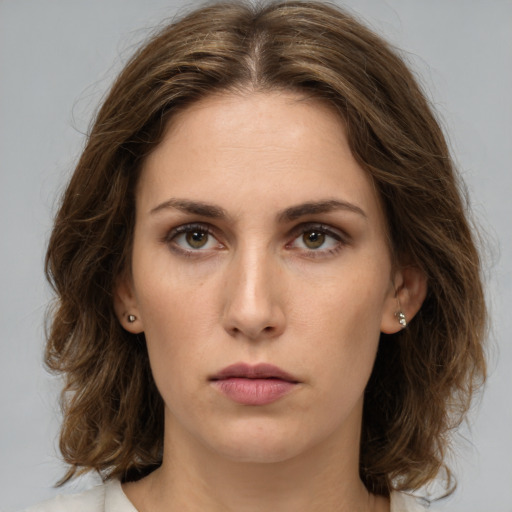 Neutral white young-adult female with medium  brown hair and brown eyes