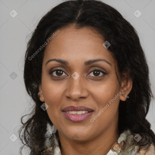 Joyful black adult female with medium  brown hair and brown eyes