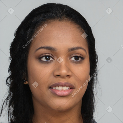 Joyful black young-adult female with long  black hair and brown eyes