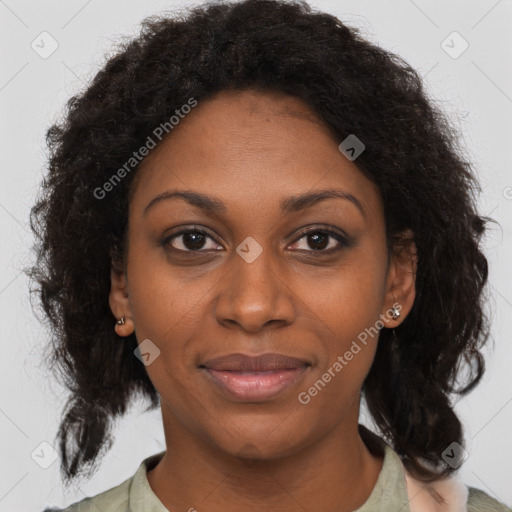 Joyful black young-adult female with medium  brown hair and brown eyes