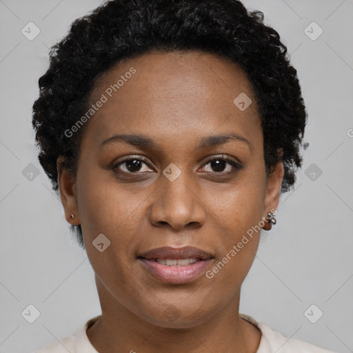 Joyful black young-adult female with short  black hair and brown eyes