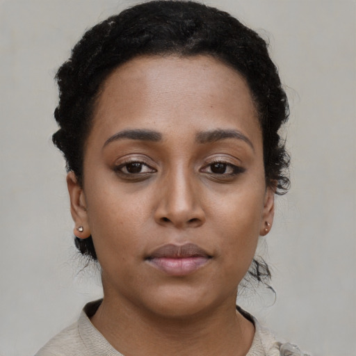 Neutral latino young-adult female with short  brown hair and brown eyes