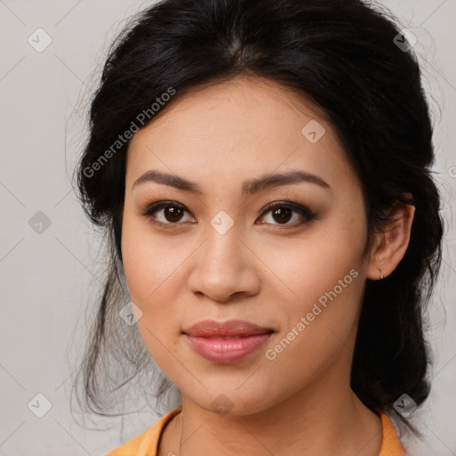 Joyful latino young-adult female with medium  brown hair and brown eyes