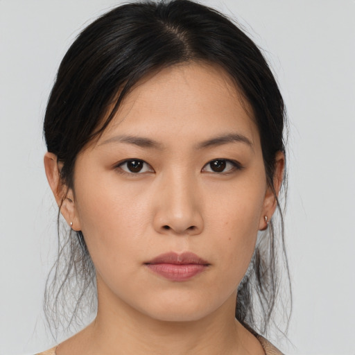 Neutral asian young-adult female with medium  brown hair and brown eyes