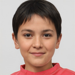 Joyful white child female with short  brown hair and brown eyes