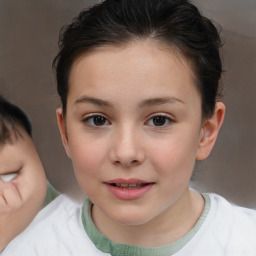 Joyful white child female with short  brown hair and brown eyes