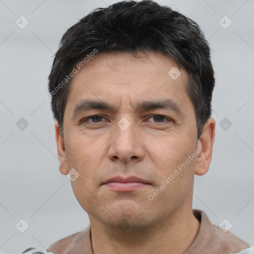 Neutral white adult male with short  black hair and brown eyes