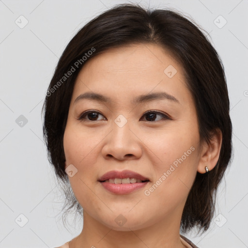 Joyful asian young-adult female with medium  brown hair and brown eyes