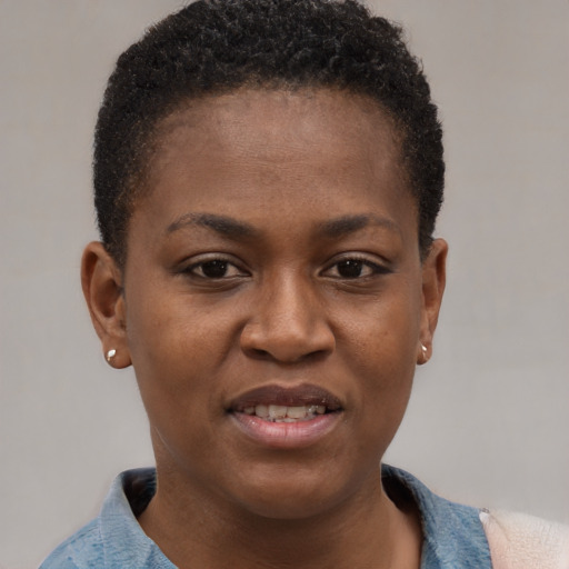 Joyful black young-adult female with short  brown hair and brown eyes