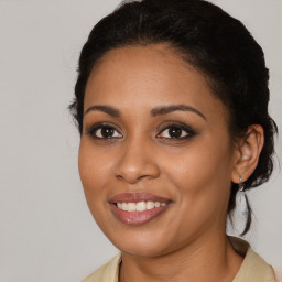 Joyful latino young-adult female with medium  brown hair and brown eyes