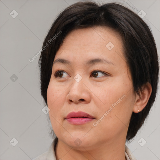 Joyful white adult female with medium  brown hair and brown eyes