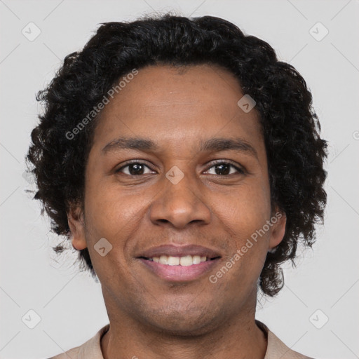 Joyful black young-adult male with short  brown hair and brown eyes