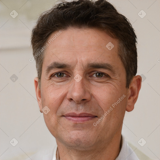 Joyful white adult male with short  brown hair and brown eyes