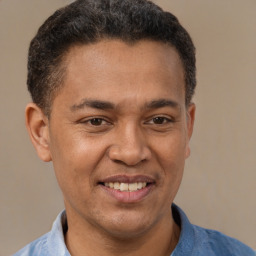 Joyful latino adult male with short  brown hair and brown eyes