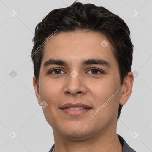 Joyful white young-adult male with short  black hair and brown eyes