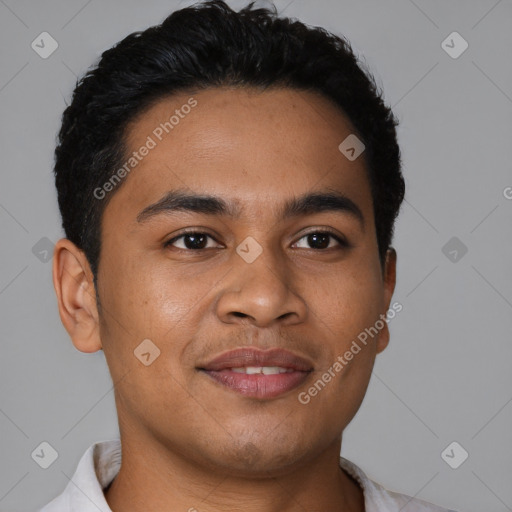 Joyful latino young-adult male with short  brown hair and brown eyes